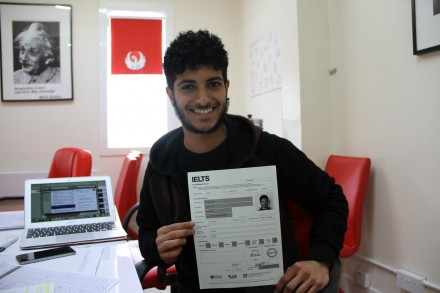 A boy with IELTS application form for IELTS training in Kuwait